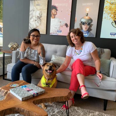 Robin and Eva with an adoptable dog in the CBE office