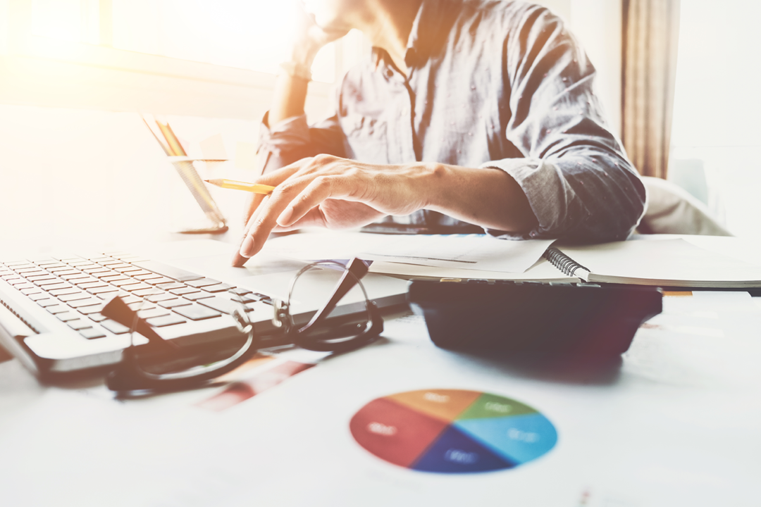 man calculating cost of starting a real estate career