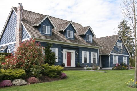 exterior of blue home from side angle