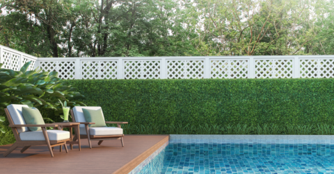 Pool with lounge chairs next to it
