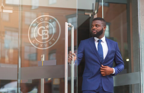 Agent standing outside of coldwell banker office