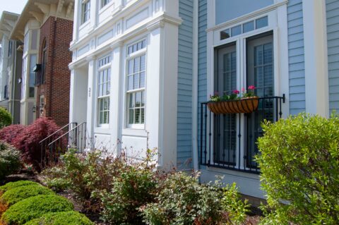 Close up of blue townhouse on a sunny day