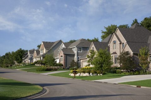 street view of suburban neighborhood row of houses