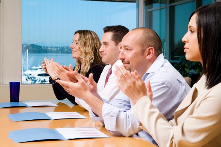 people at a professional clapping