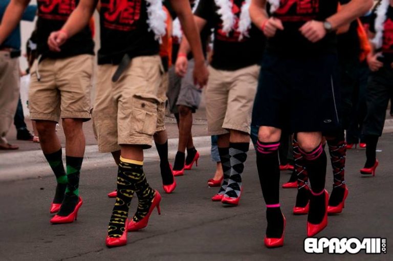 Men walking in red high heels
